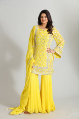 Crafted in luminous yellow georgette, this ensemble glows with intricate Gotta Patti and hand embroidery