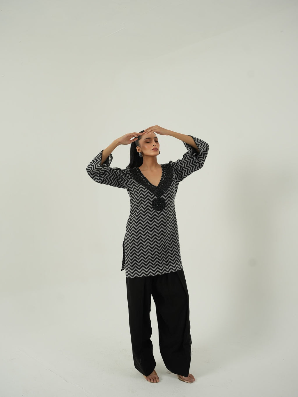 Full look of Black and White Chevron kurta with black Farshi salwar