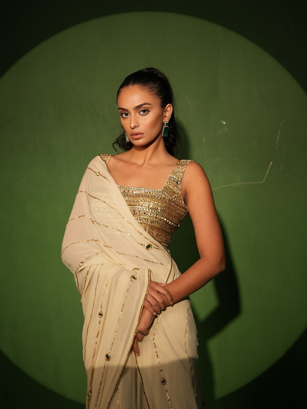 Ivory georgette saree with hand embroidered gold blouse